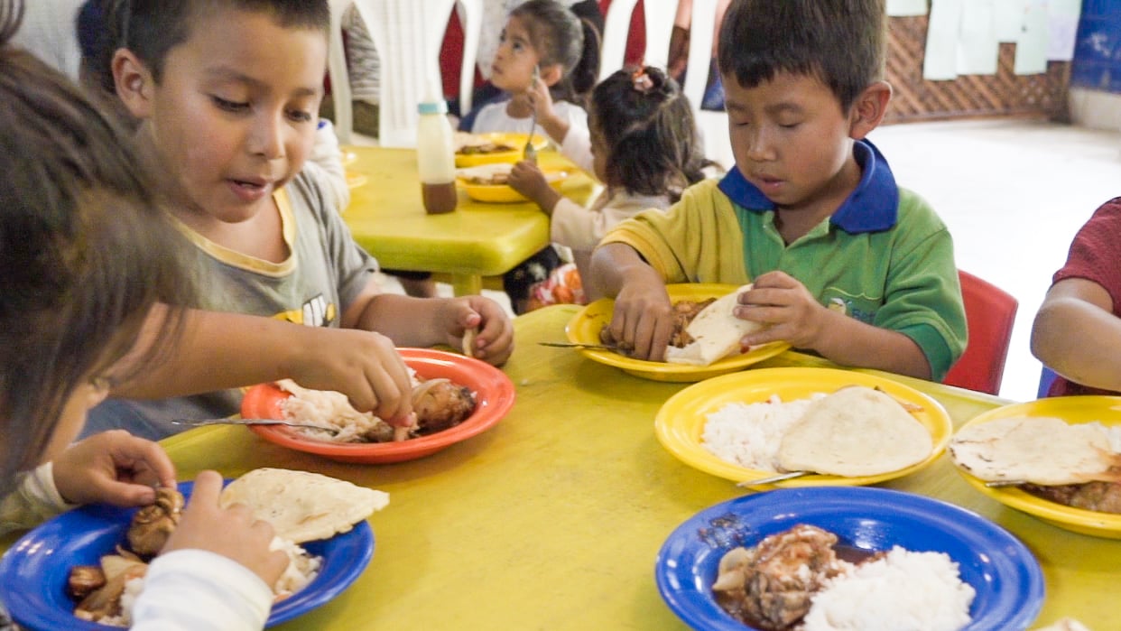 Children enjoy a hot meal provided by the Bethany Center in Guatemala.