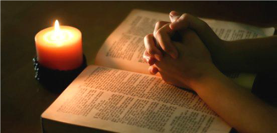 praying bible hands.png